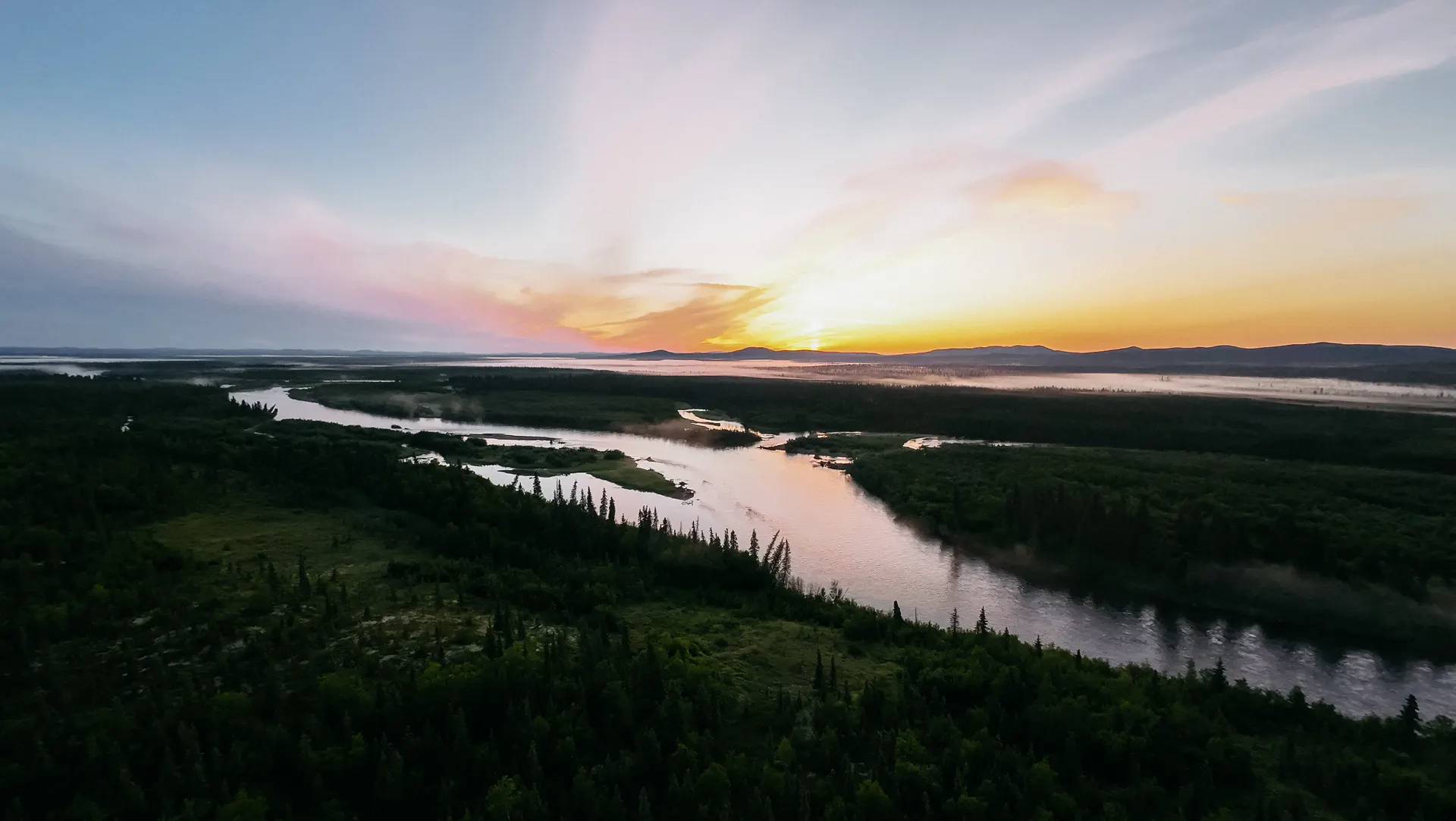Sunrise over remote wilderness water — the country Billy calls home