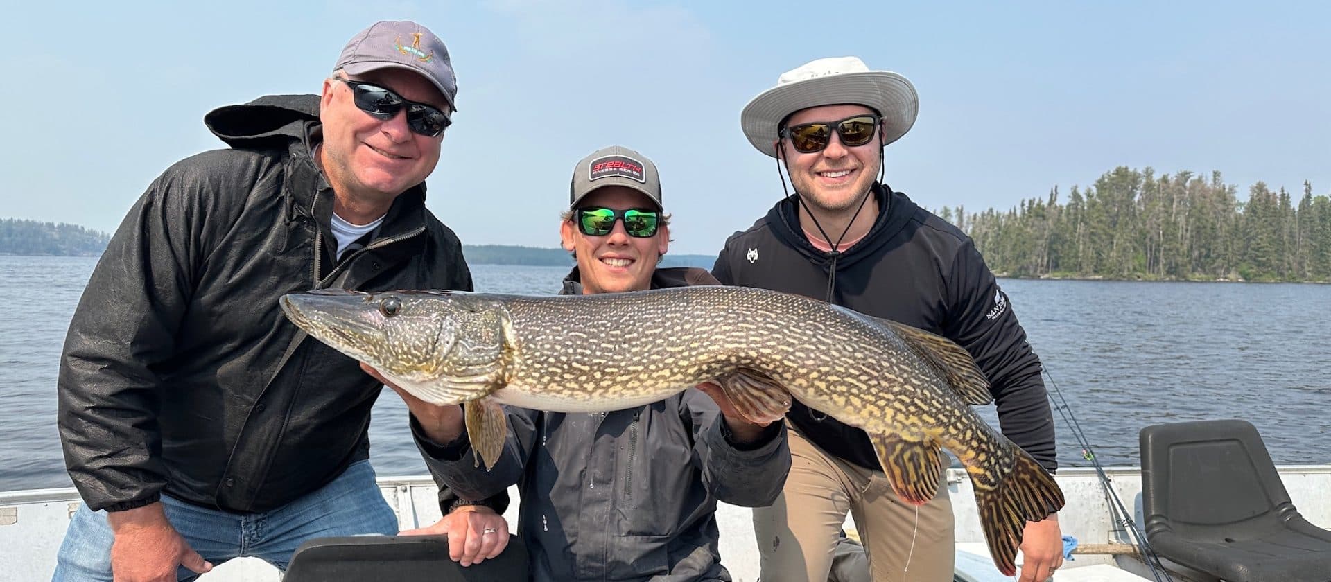 Fishing rod against a sunset on Dogskin Lake