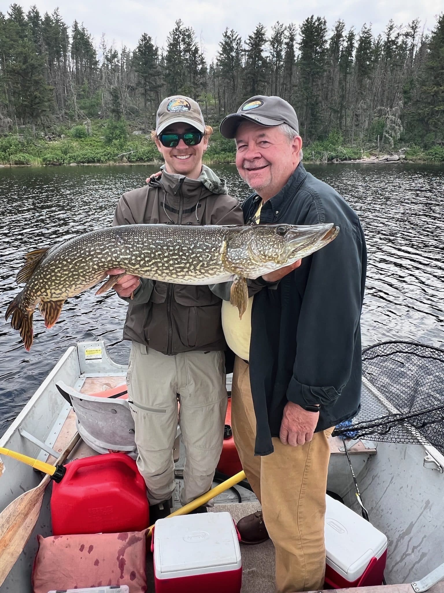 Father and son with pike